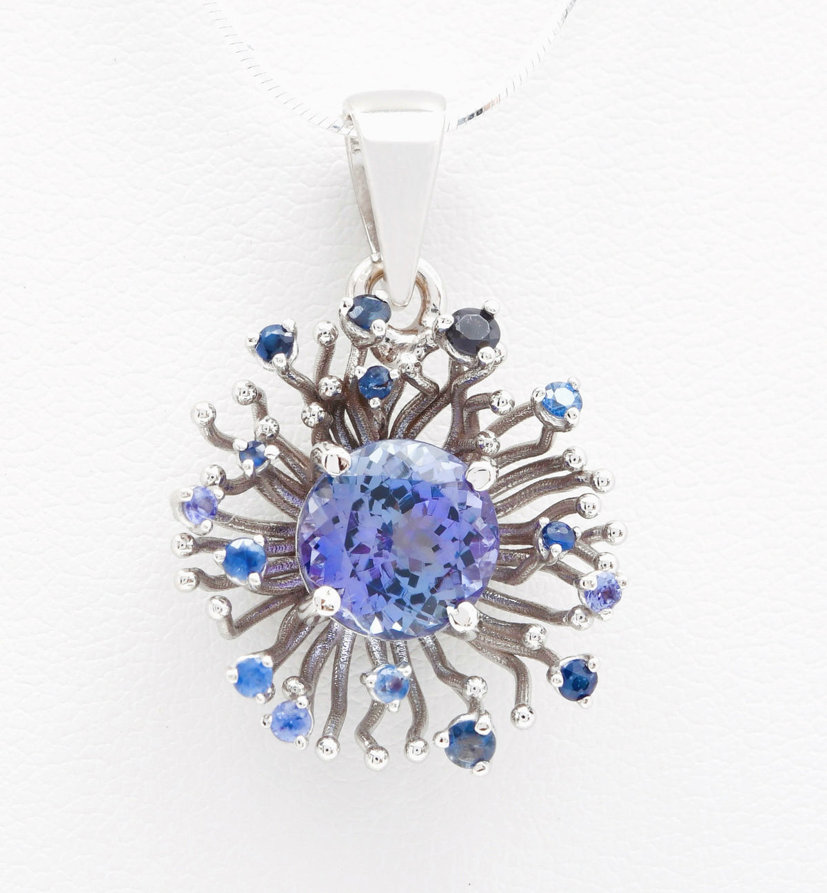 Coral Tanzanite pendant in 18K palladium white gold