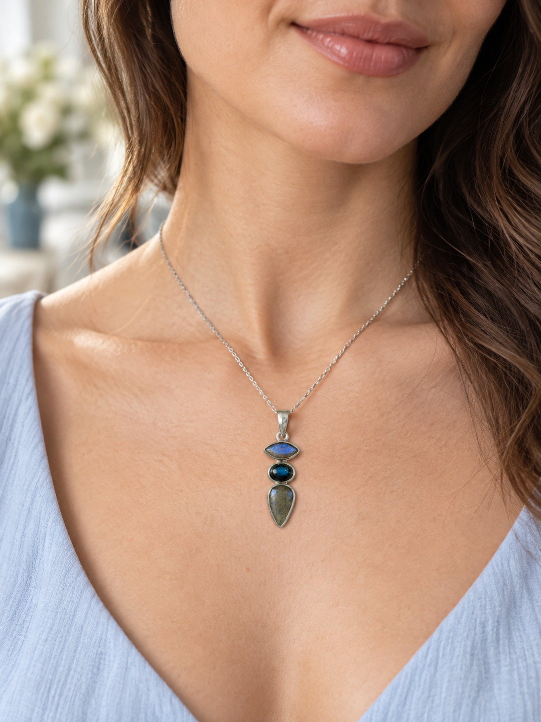 Maka Kahikolu labradorite pendant worn on a silver chain
