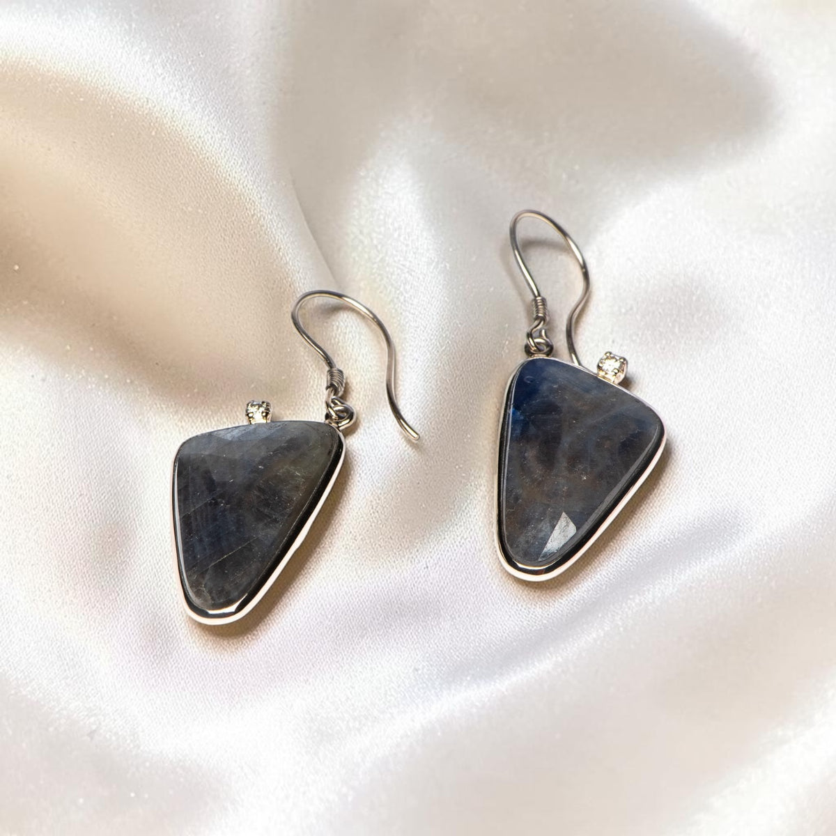 Sapphire Diamond Edge earrings on ivory satin